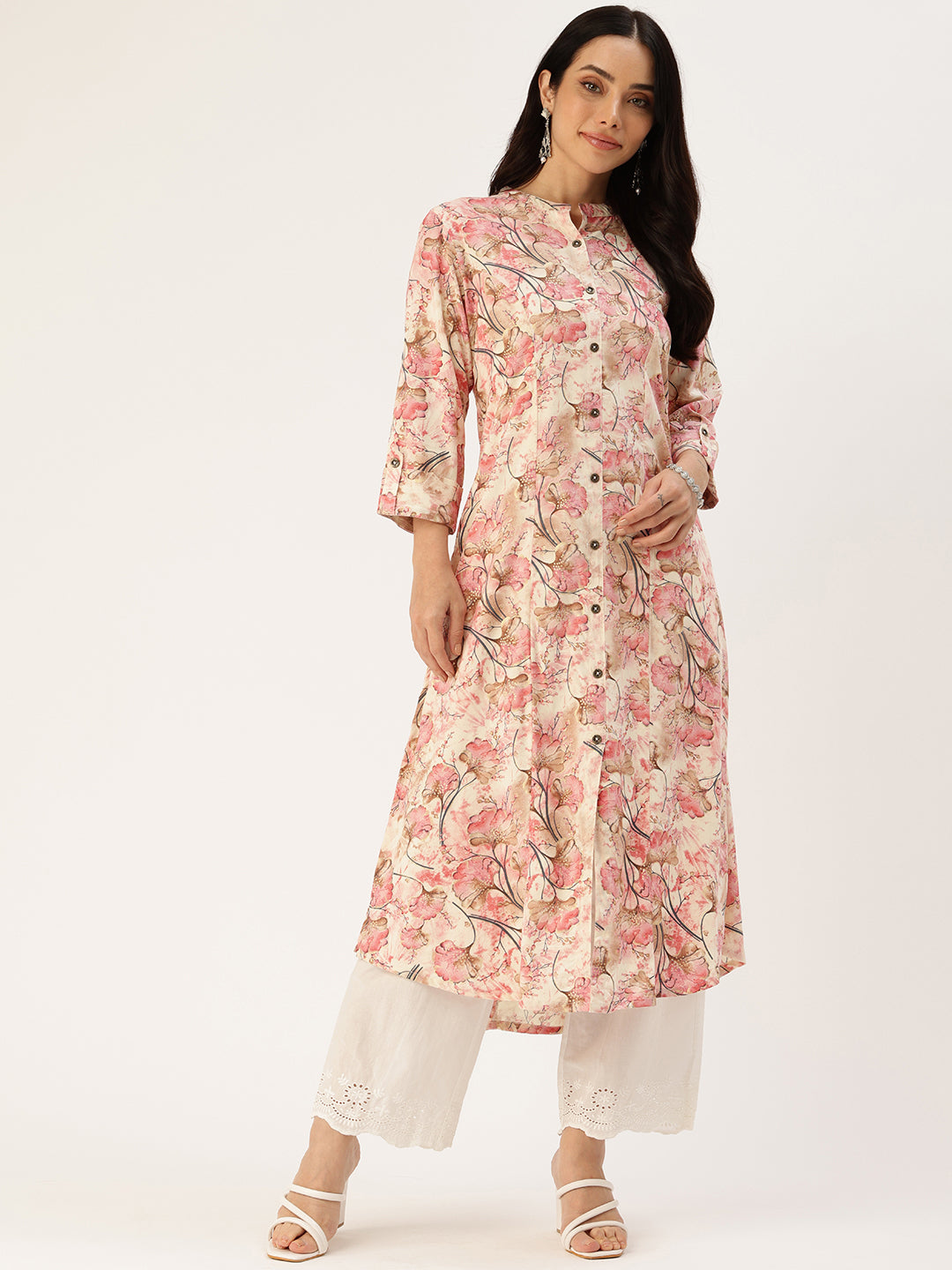 A woman wearing an off white floral printed kurta with a mandarin collar and 3/4 sleeves, paired with white trousers, standing against a neutral background. Off White Floral Printed Mandarin Collar Kurta, Princess Cur Kurta, A-Line Kurta, Floral Print, Mandarin Collar kurta, printed kurta