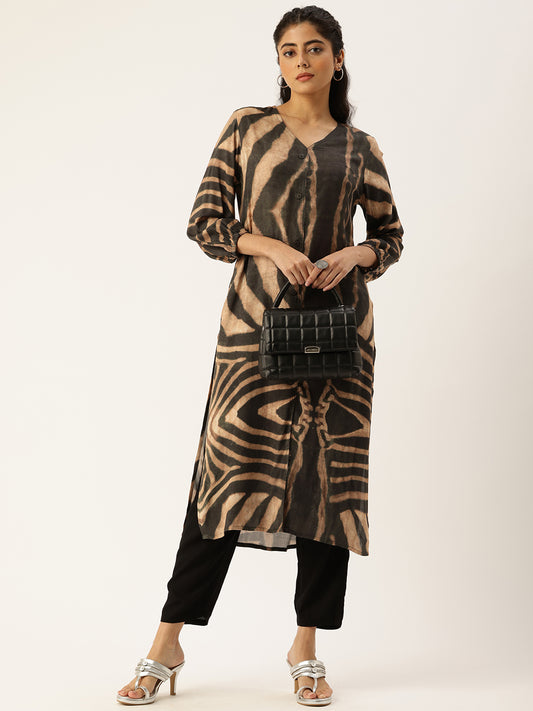 A woman wearing a brown digital printed V-neck kurta with 3/4 sleeves, paired with black trousers, standing against an orange background. Brown Digital Printed V-Neck Kurta, Princess Cur Kurta, A-Line Kurta, Floral Print, Mandarin Collar kurta, printed kurta
