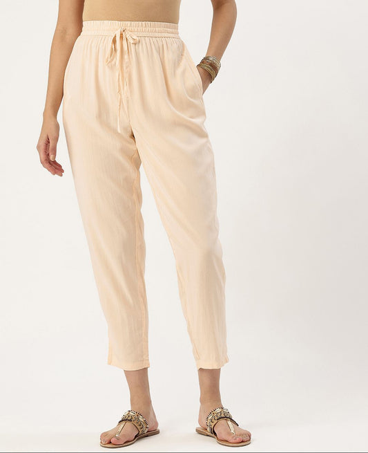 Beige pants worn by a person on a white background, Beige Solid Pencil Pant, Solid pencil Pant, plain pant 