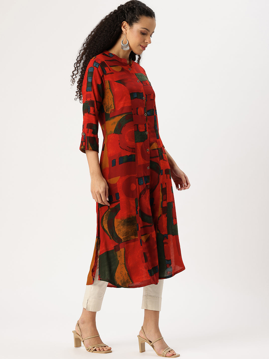 Woman wearing a red and black patterned kurta with white pants on a white background, Red Geometric Printed Kurta, Office Wear Kurta, Black Printed kurta, Printed Kurta